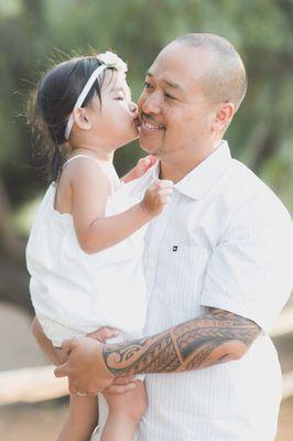 My baby girl kissing her daddy... great candid shot!