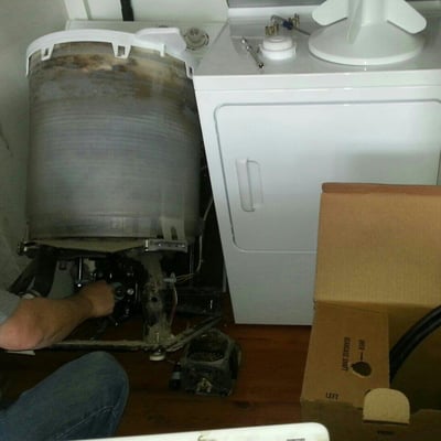 Joe installing a motor in a washer.