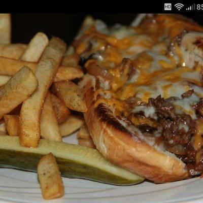 Bangor steak and cheese made with shaved prime rib tossed in a light BBQ sauce.