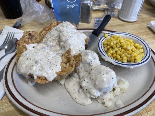 Rick's Chop with mashed potatoes, gravy and corn.