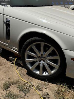 The fender and lower portion of my car and the bent lower panel as it is still sitting a the alliance lot where Jason lazy put it.