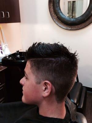 This is a fade guy's cut with dark chocolate brown color