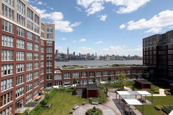 Views overlooking courtyard out to Hudson River and Midtown Manhattan from Maxwell Place in Hoboken