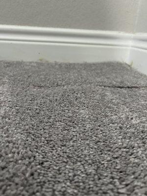 Bubble in carpet where seam was placed