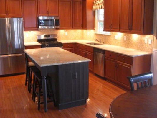 Onyx backsplash, granite, hardwood