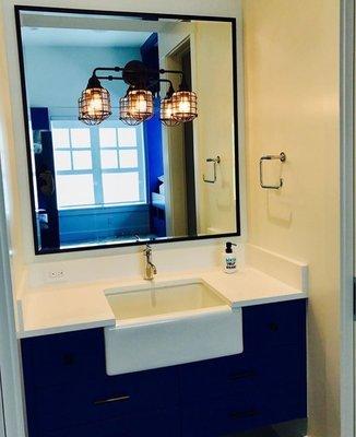 Custom vanity mirror, notice the light fixture is cut into the glass.