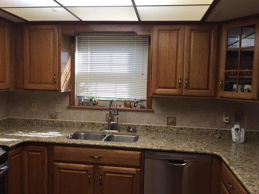 Updated and refreshed kitchen with new granite countertops and undermount sink with new faucet.