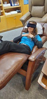 Relaxing in Hale Zero gravity chair with heat and massage.