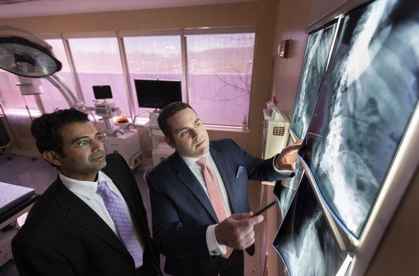 Dr. Harshpal Singh, Dr. Aaron J. Greenberg reviewing diagnostic images