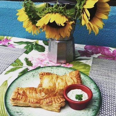 Our Empanadas with variety of fillings, such as Ham and Cheese, Pulled Chicken and Cilantro, Spinach and Feta, Picadillo and Sweet Plantains