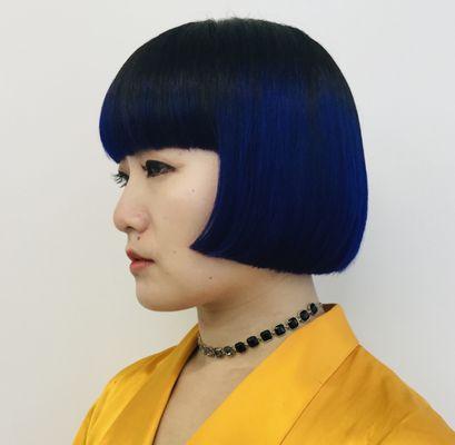 One length bob haircut with blue hair color