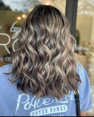 Rich fall dimensional haircolor and soft layers on thick hair.