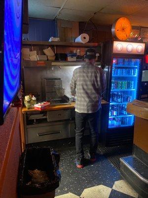 Bar tender making food