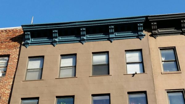 Facade and cornice restored in historical colors.