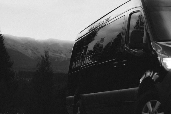 Exterior of a Black Label Mercedes Sprinter van