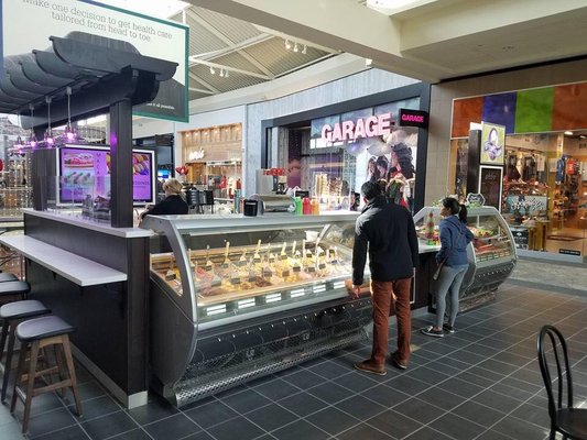 Ice cream shop in Mayfair Mall Milwaukee. The tops were fabricated and installed by Premier Countertops