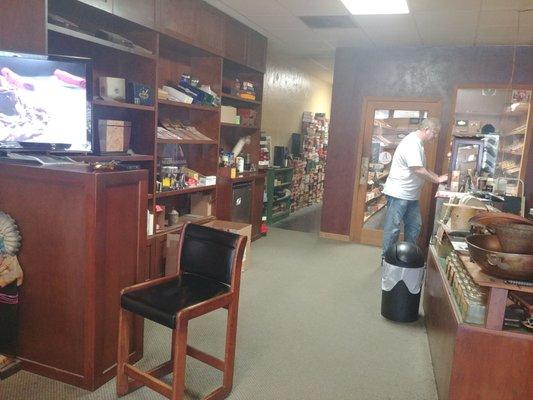 Shop owner, Mike Marks, in front of humidor