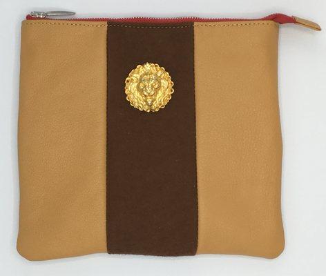 A  Tefillin bag with leather and Felt and a vintage pin