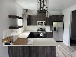 Kitchen with peninsula and floating shelves.