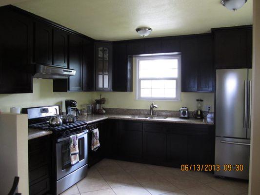 Dark Shaker with corner angled cabinet glass door.