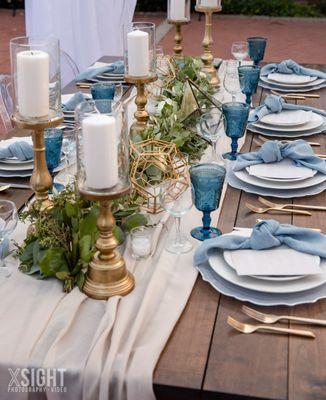 Champagne Voile sheer table veil and Spa Linnea Napkins on a rustic wood table