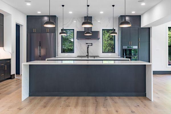 Modern kitchen with islands in custom built home