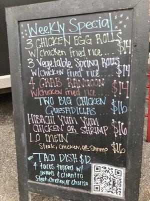 menu board in front of food trailer