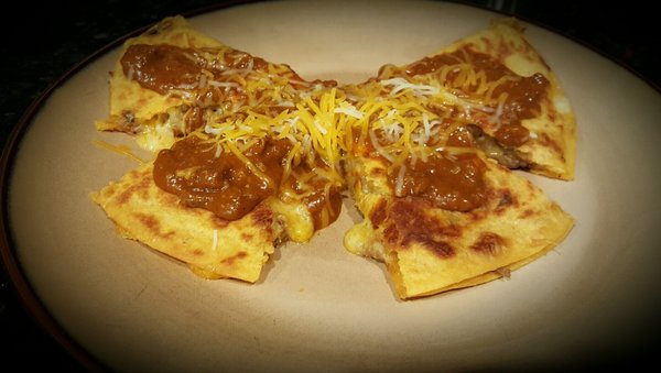 Home of the Chila-Dilla! Brisket or chicken quesadilla smothered with chili and shredded cheese.