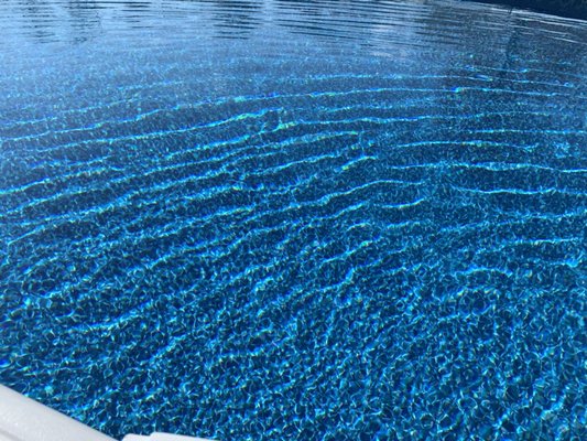 Water that's using UV light to disinfect with very low chlorine. Non corrosive to pool or bathers