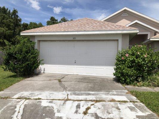 Trim Hedges on either side of the garage