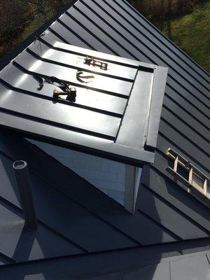 Recessed gutter on a dormer.