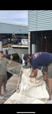 Andrew and Mike organizing and repairing my sailboat rigging and lines.