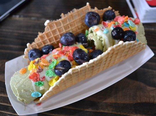 matcha made in heaven waffle taco w/ condensed milk, fruity pebbles, & blueberries