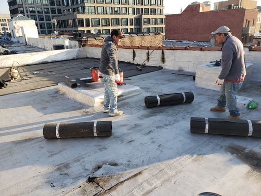 Installing new rubberized cool roof(APP 160).