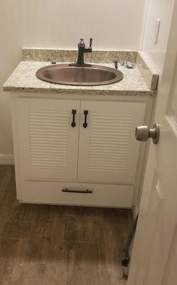 Louvered cabinet doors for her guest bathroom.