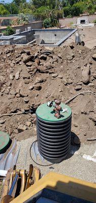 Plastic risers on septic tank