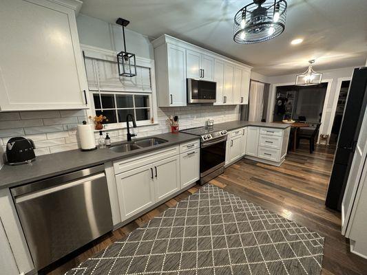 Cabinetry and countertops completed for remodeling project.