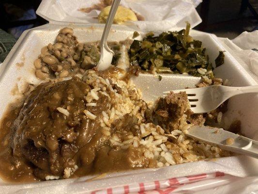 Hamburger steak on rice, collards and black eyed peas with cornbread.  Way more than I can eat.