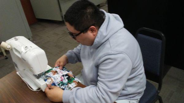 Manager Adolfo sews masks for staff and area seniors