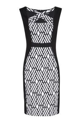 "Noelle" form-fitting black sleeveless dress with patterned front bodice and crisscross neckline by Connected Apparel.