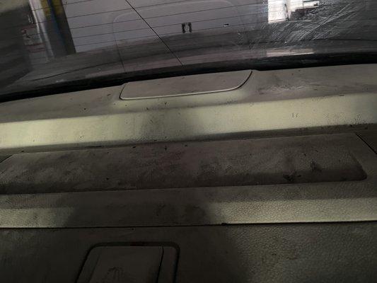 (Back of car) tint not properly laid, black residue everywhere, and back glass not cleaned up after installation