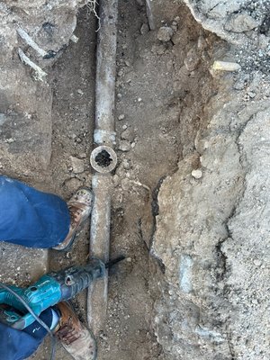 Cutting old cast iron sewer pipe.