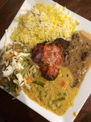 Tandoori chicken, saffron rice, spicy noodles, vegetables and lentils. Amazing food!