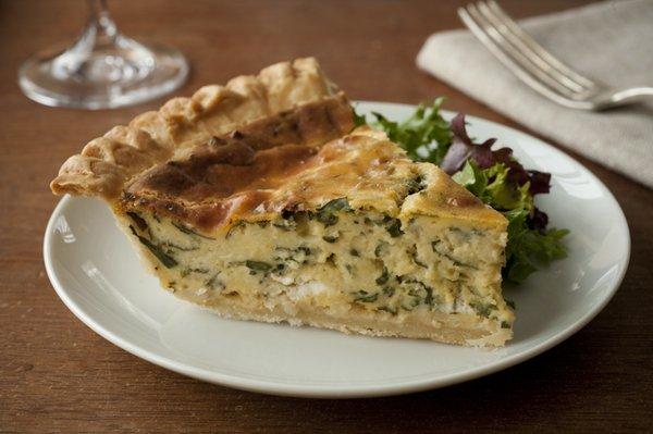 A slice of our Spinach and Goat Cheese Quiche