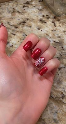 Red with snowflake accent nail