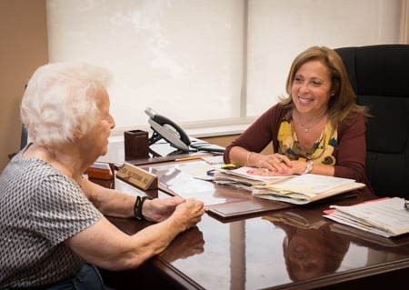 Dr.Valderrama discusses test results with a long time patient