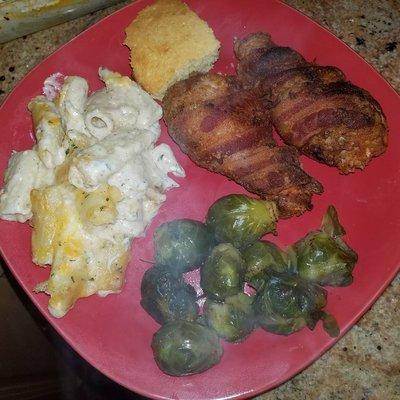 Bacon wrapped chicken, mac n cheese, cornbread