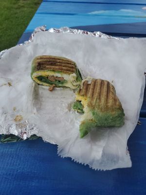 Sausage, egg and cheese in a spinach wrap.