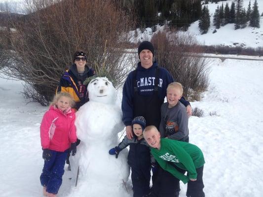 Anthony White with his beautiful wife and 4 children playing in the snow on Beaver, UT mountain