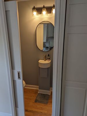 Half bath addition with pocket door